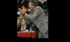 Coach Jon Bertsch applauds team.Mar 2 issue.jpg Image